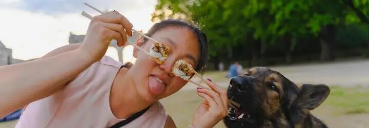 Woman and dog and sushi in a park (come on, sushi, phishing, this stuff is comedy gold!)